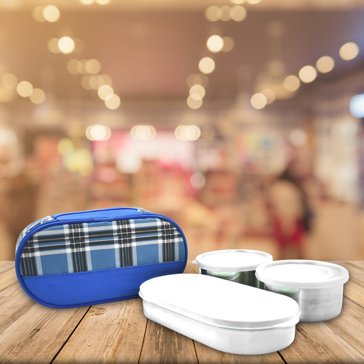 Stainless steel lunch containers ready for packing office meals.