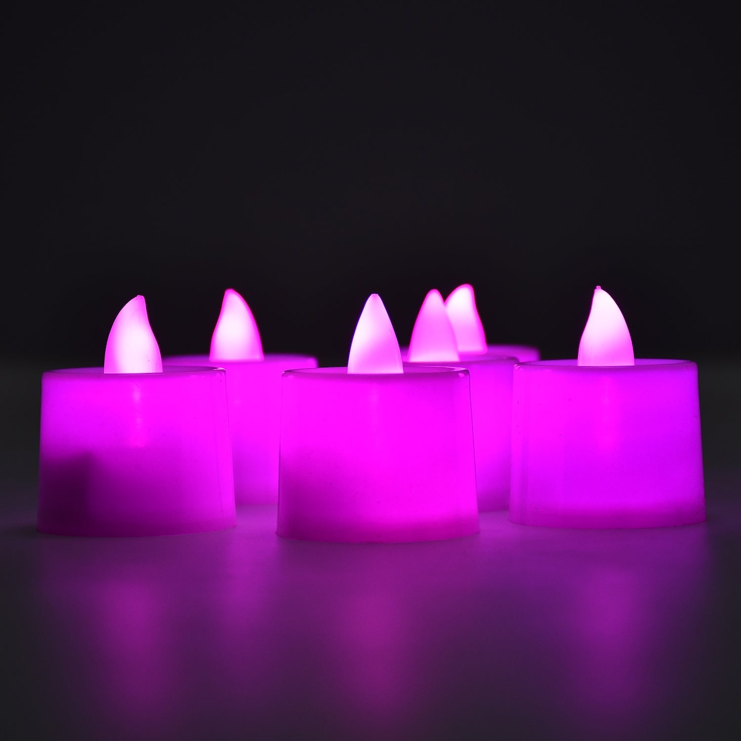 Twenty-four pink LED tealight candles arranged for home decoration.
