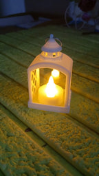 Arrangement of multiple flameless LED lanterns for a festive ambiance.