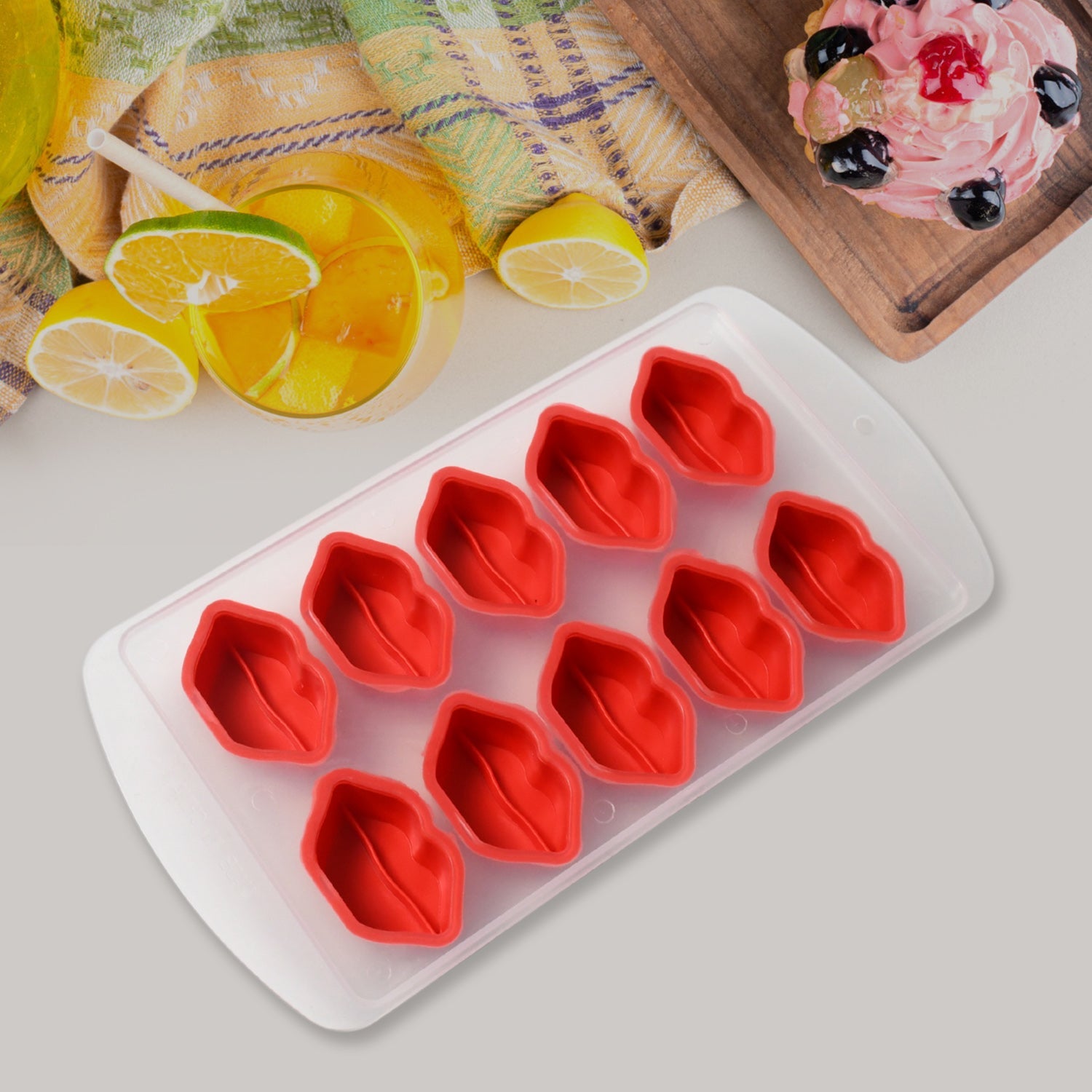 Multi-shape silicone ice cube tray filled with water in a modern kitchen setting.