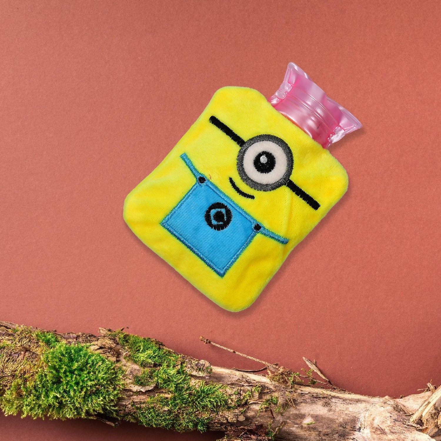 Minions hot water bag with its soft yellow fabric cover, perfect for pain relief.