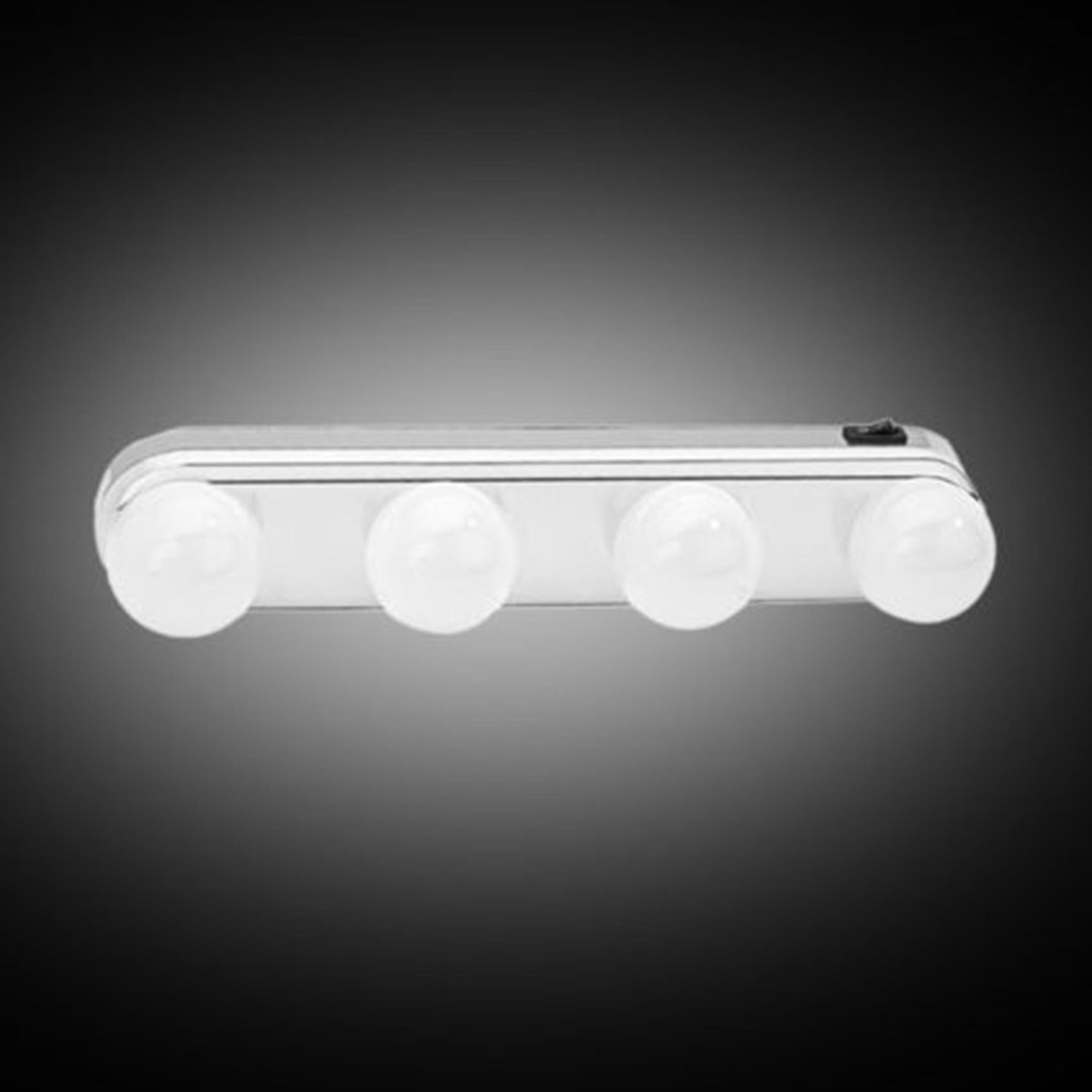 Compact LED vanity light attached to a mirror, showing even illumination.