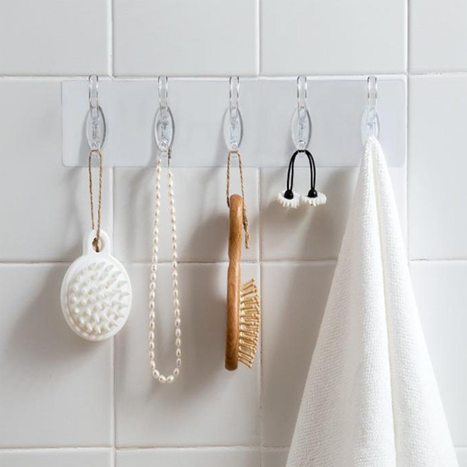 A pack of five transparent adhesive wall hooks from GlimmerHome, ready for damage-free hanging.