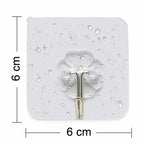 A single stainless steel adhesive hook holding a small bag.