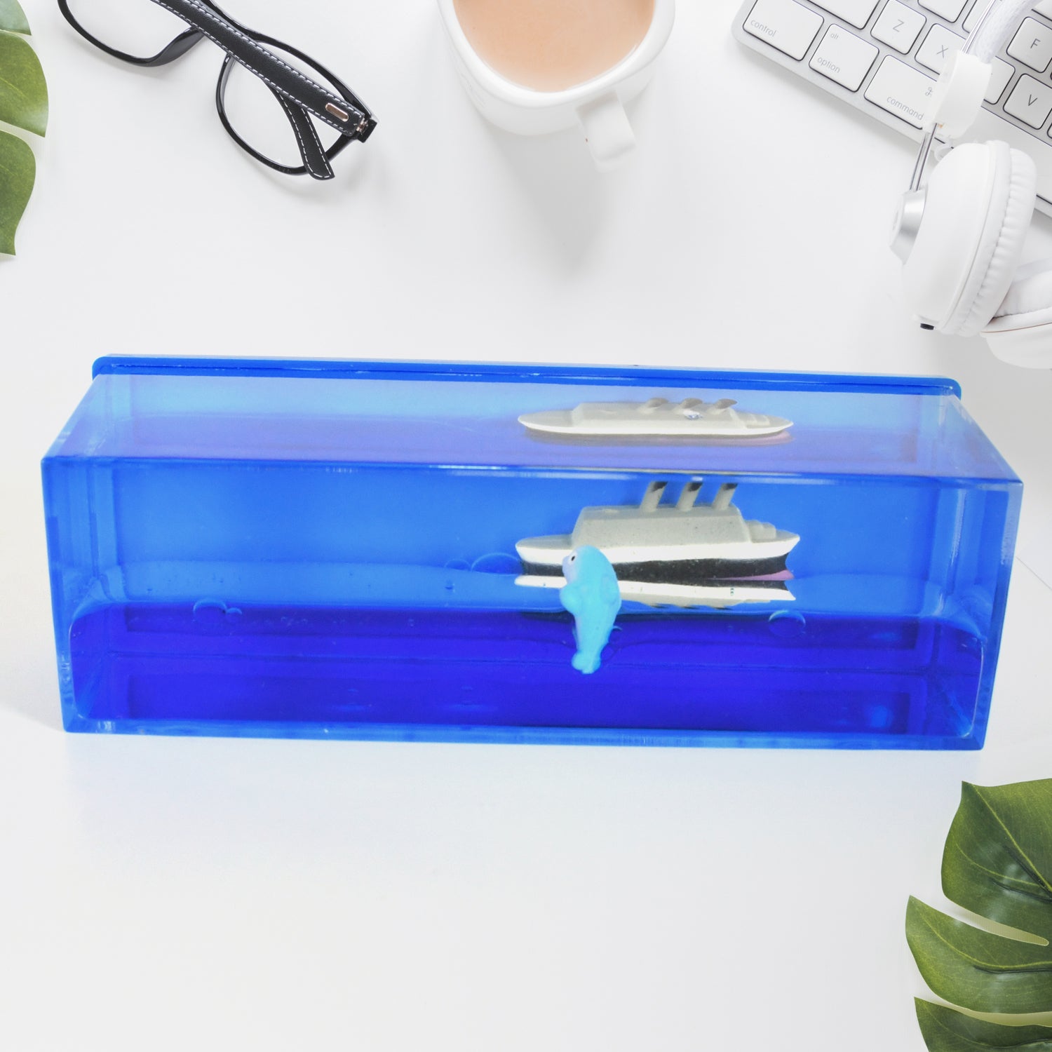 Floating Water Cruiser Ship Ornament on an office desk, perfect decor.