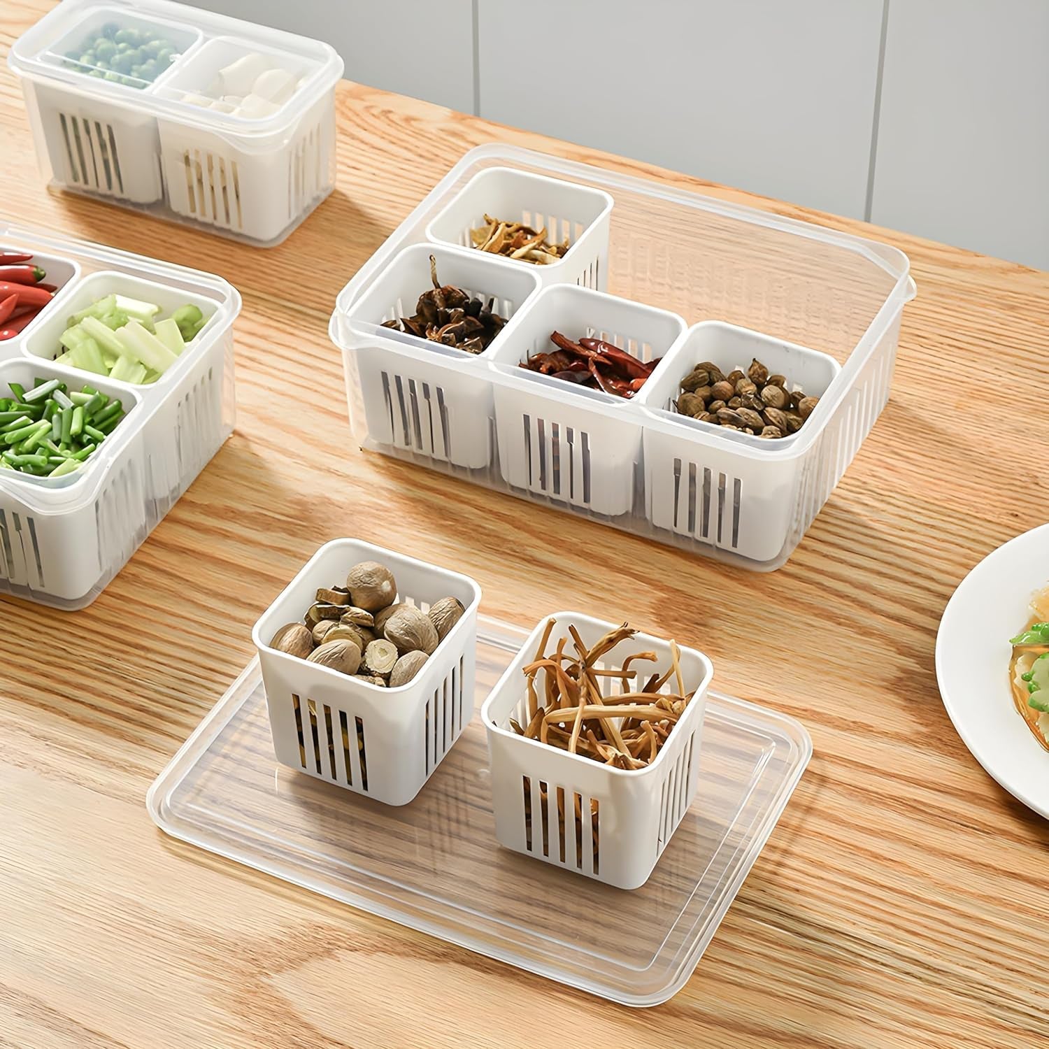 Transparent fridge organizer drawer with various food items, making contents easily visible.