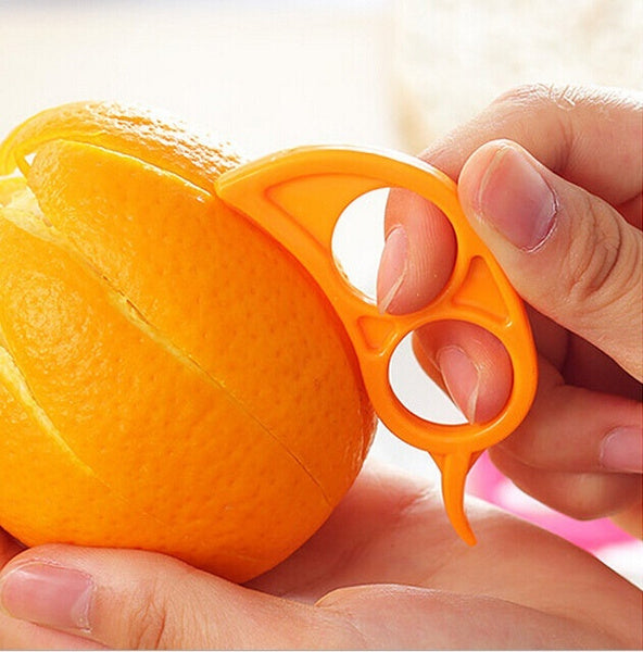 The Snail Orange Peeler in action, demonstrating how easily it removes orange peel.