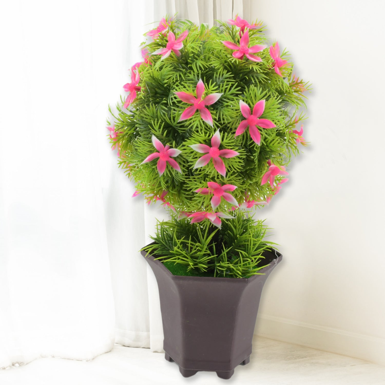 Two artificial plants with pots styled as decorative items for a console table.