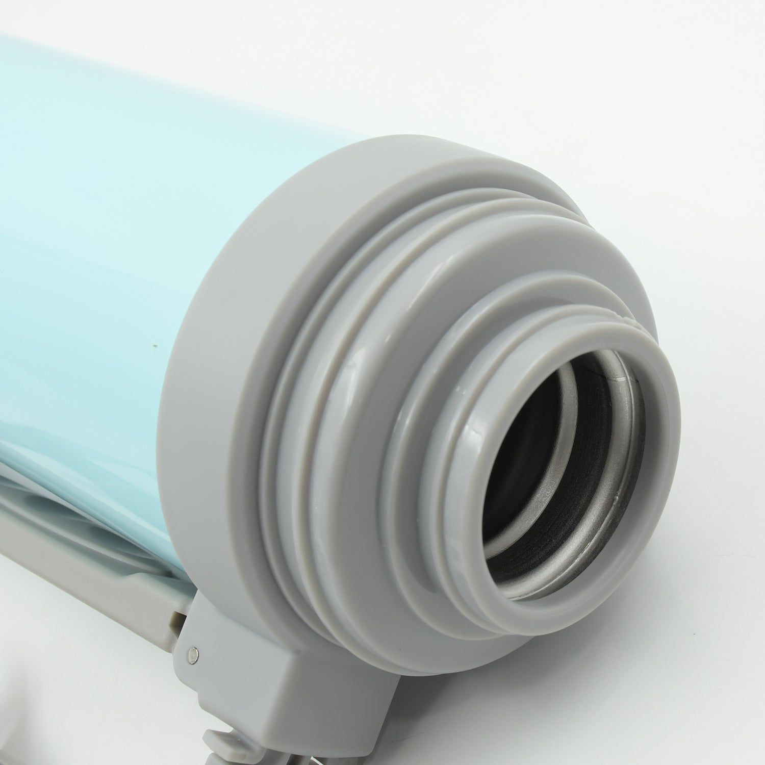 Stainless steel thermos pouring a refreshing drink into a cup.