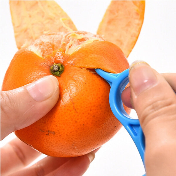 Side view of the Quickslice Snail Orange Peeler, emphasizing its compact and user-friendly form.
