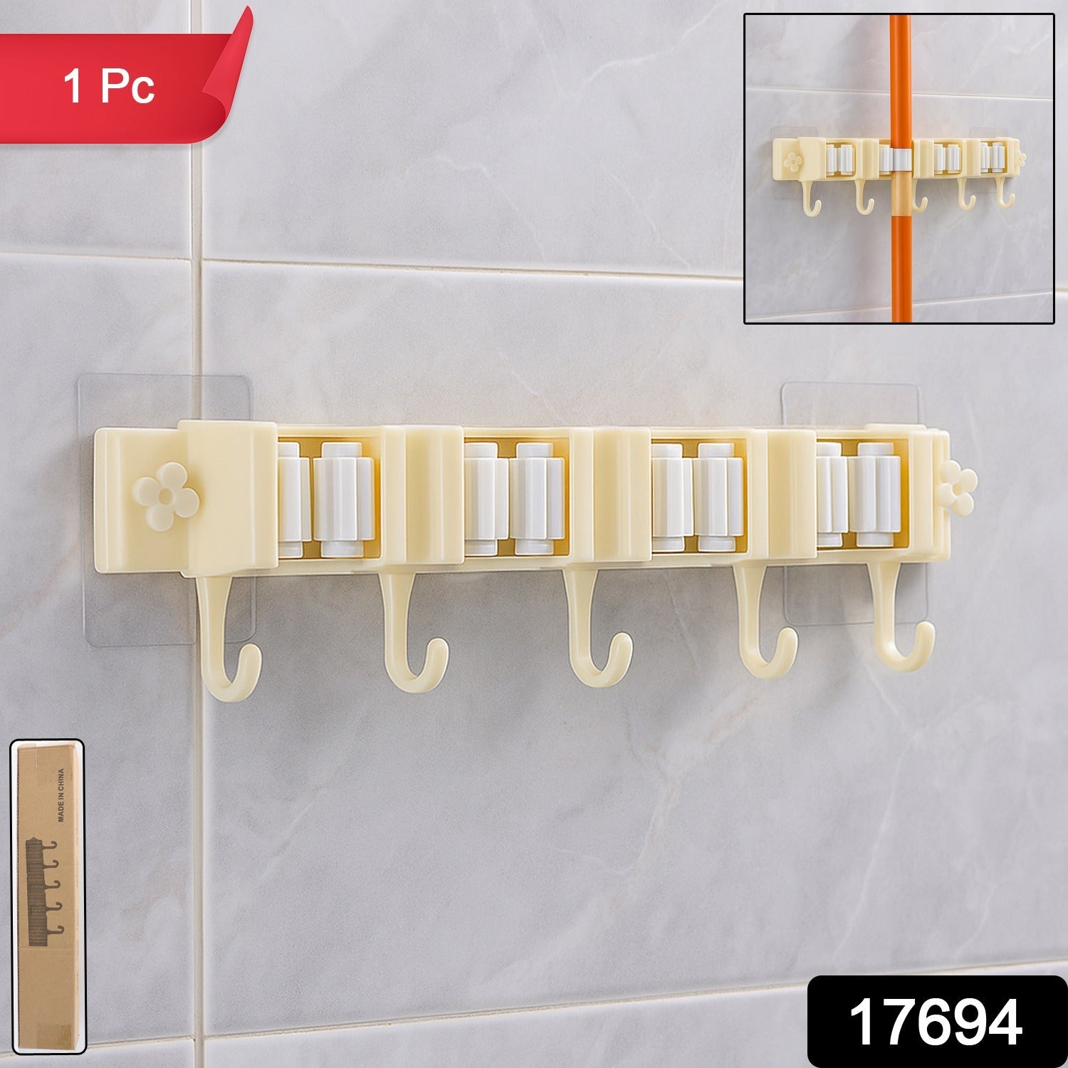 Wall-mounted broom holder securely gripping handles in household utility room