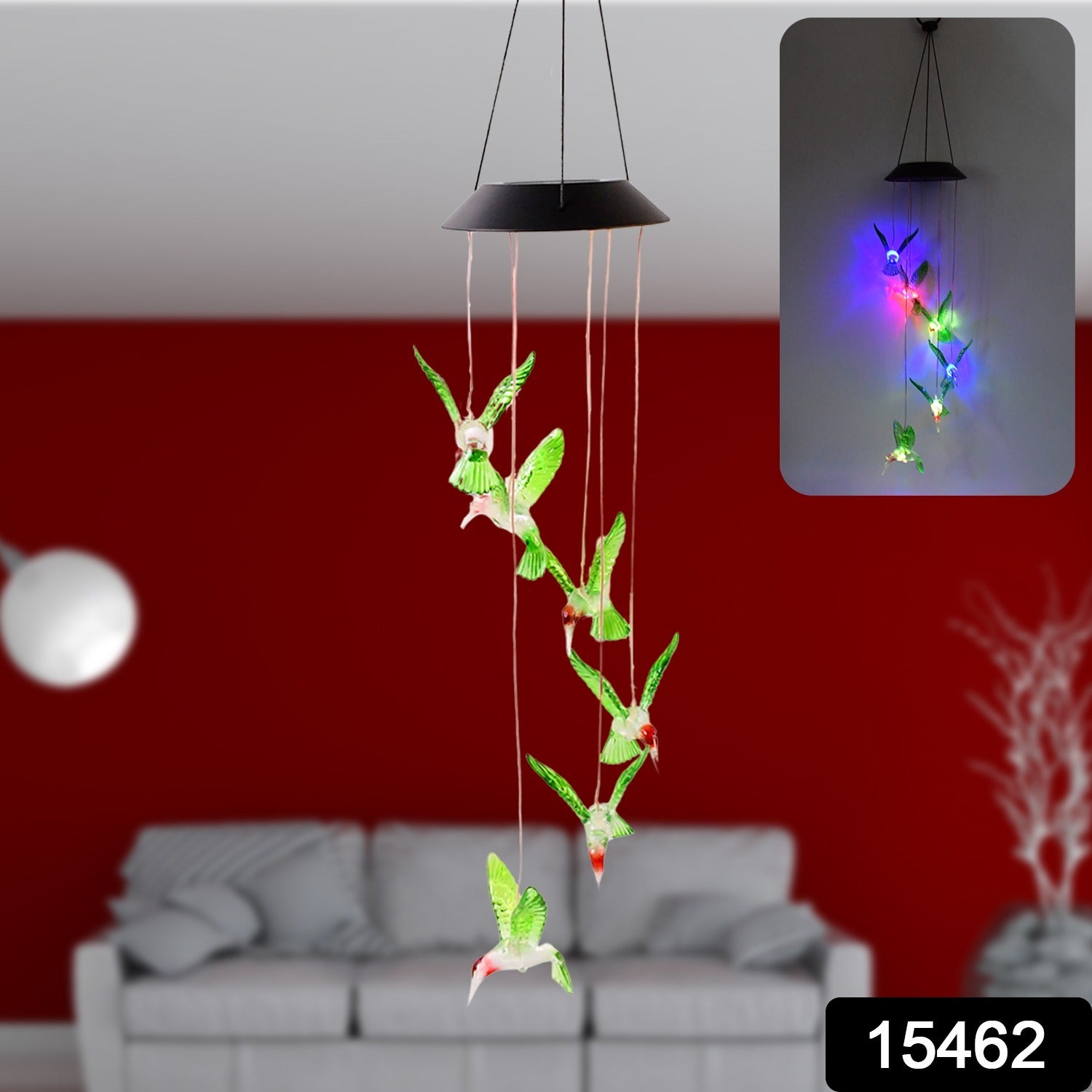 Close-up view of hummingbird solar light wind chime hanging outdoors