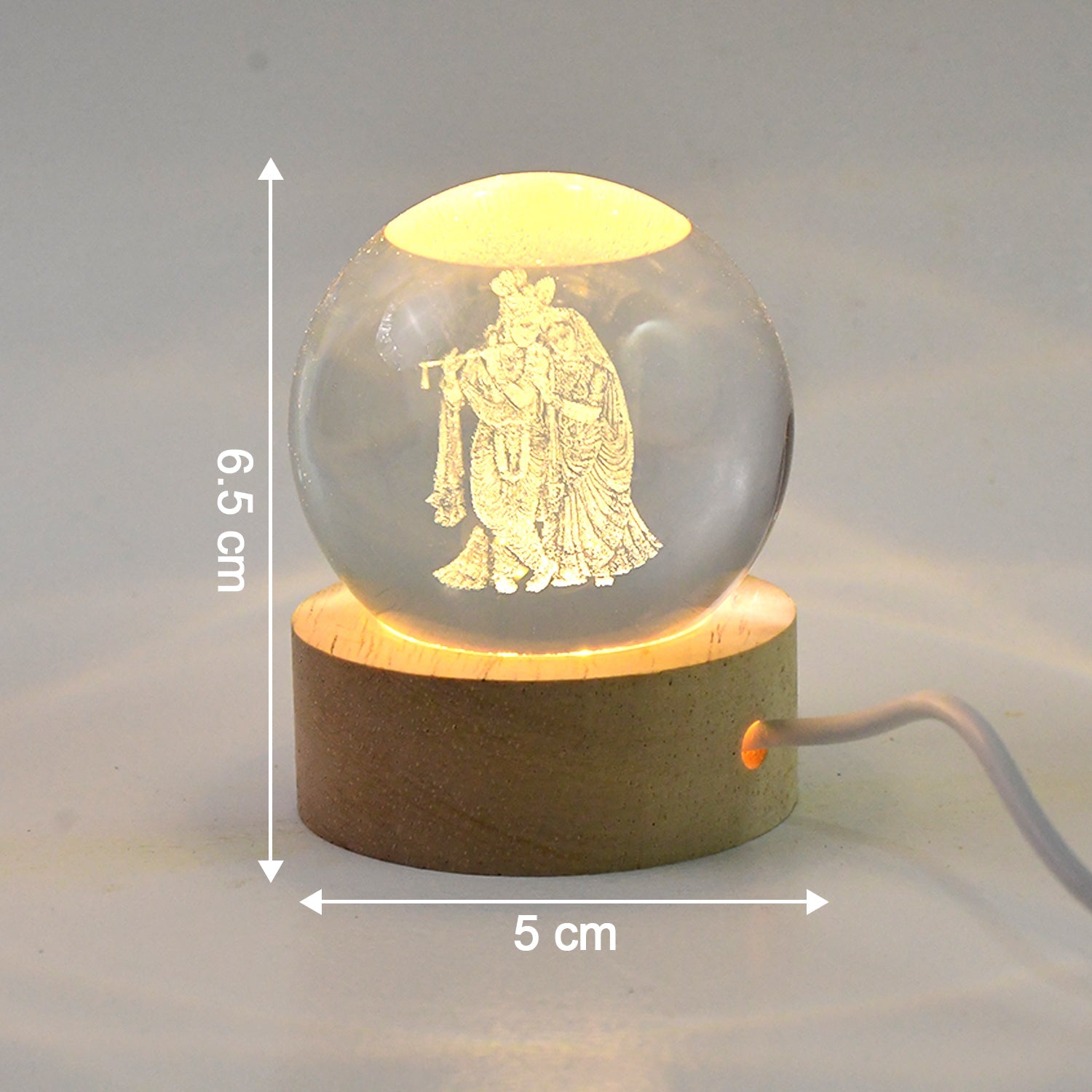 Radha Krishna 3D LED crystal lamp illuminating a bedroom at night.