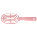 Detail of curved head and flexible bristles for scalp massage on hair brush