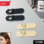 Close-up of snap hair clips featuring playful cartoon characters