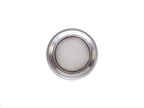 Stainless steel drain strainer placed inside a kitchen sink, ready for use.