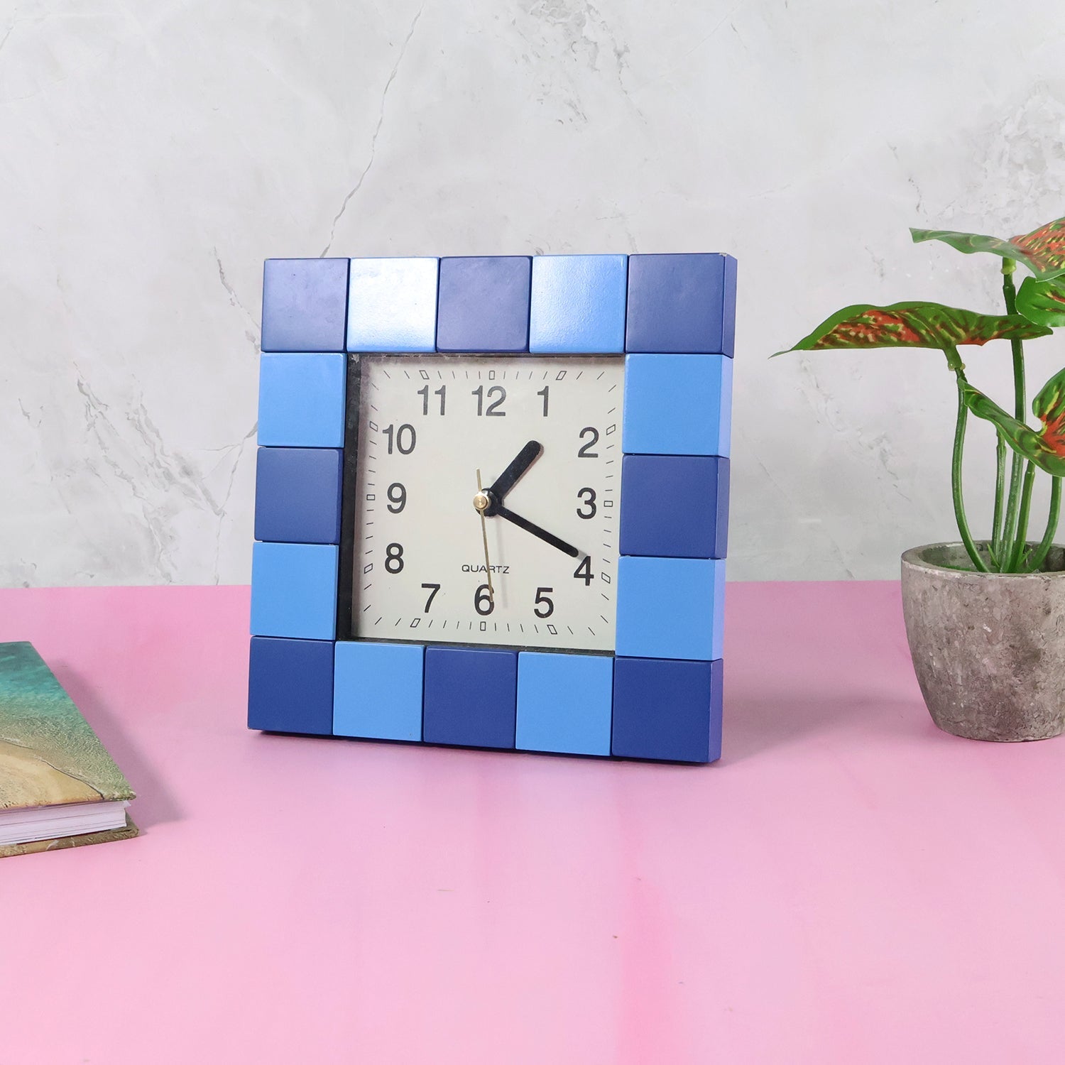 Angled view of the compact square table clock, ideal for small spaces.