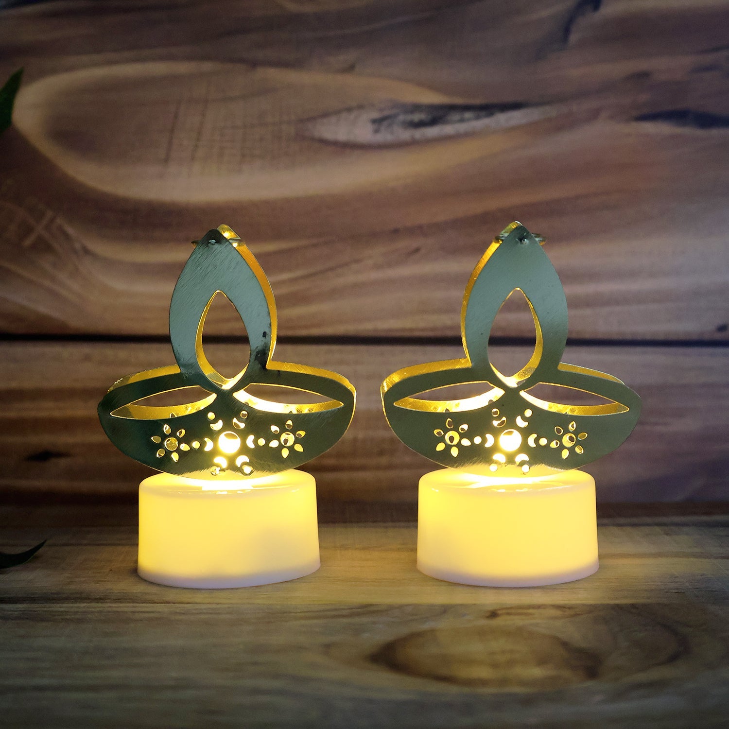 Decorative arrangement of golden diya LED tealight candles for festive ambiance