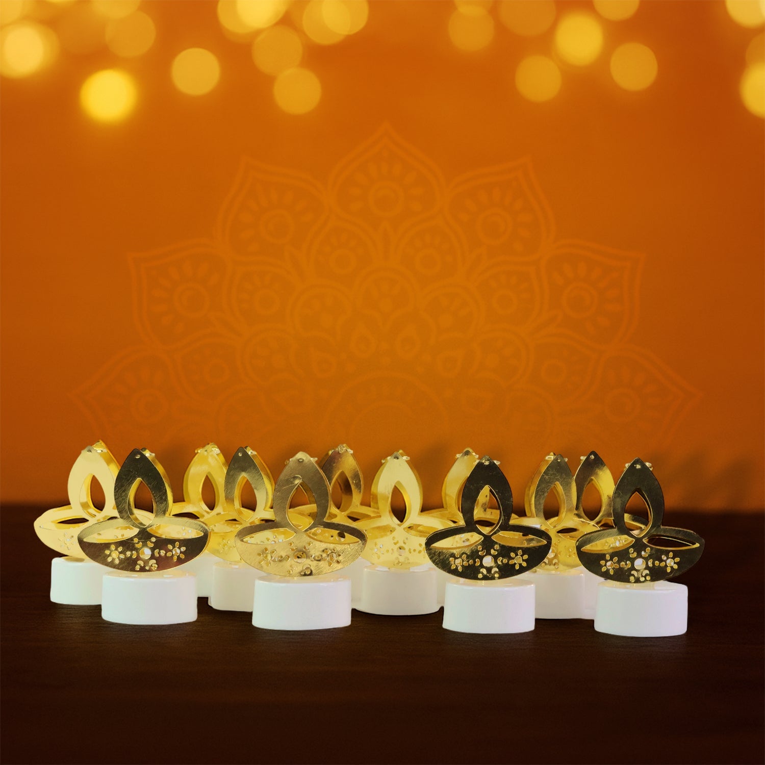 Close-up view of golden diya shaped LED candle light showing warm illumination