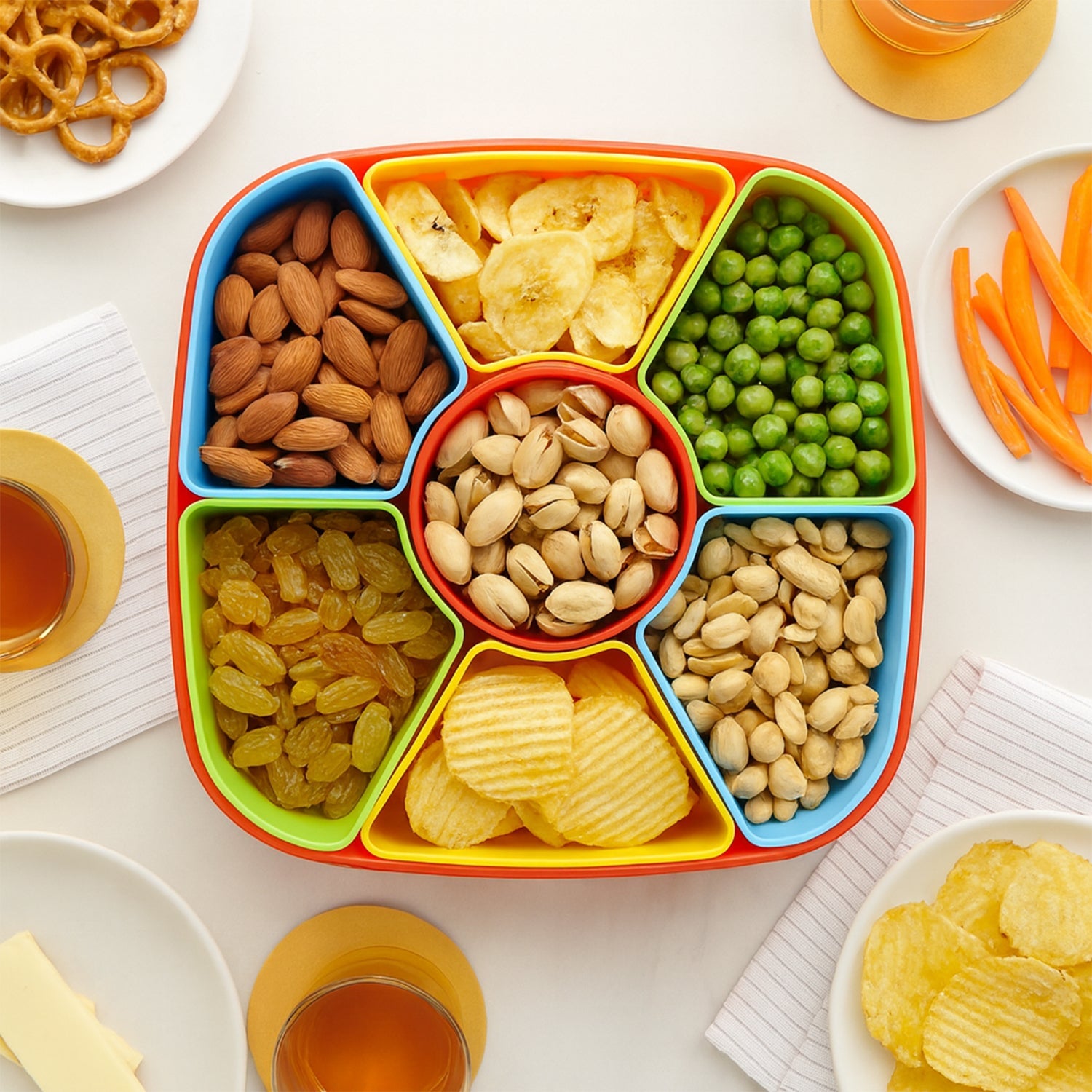 Side angle of dry fruit box filled with nuts and candies in BPA-free organizer