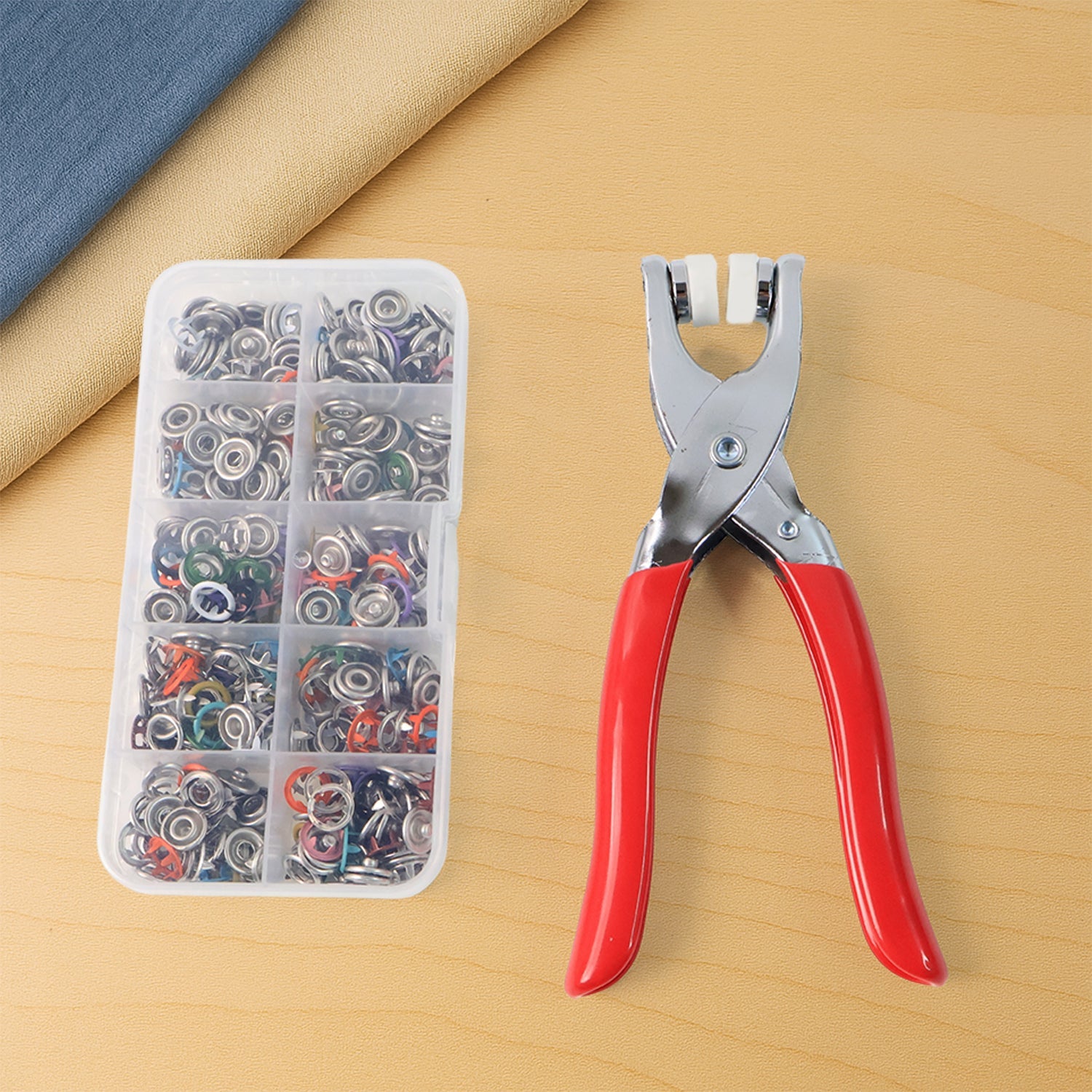 Heavy duty snap button plier kit with 100+ assorted colored studs organized in box