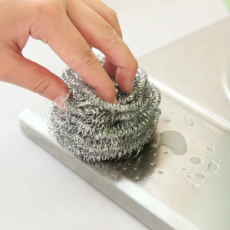 Durable round stainless steel scrubber, perfect for tackling stubborn grime in the kitchen.