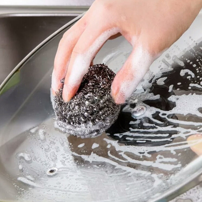 Close-up of a robust stainless steel scrubber, ideal for tough kitchen cleaning.