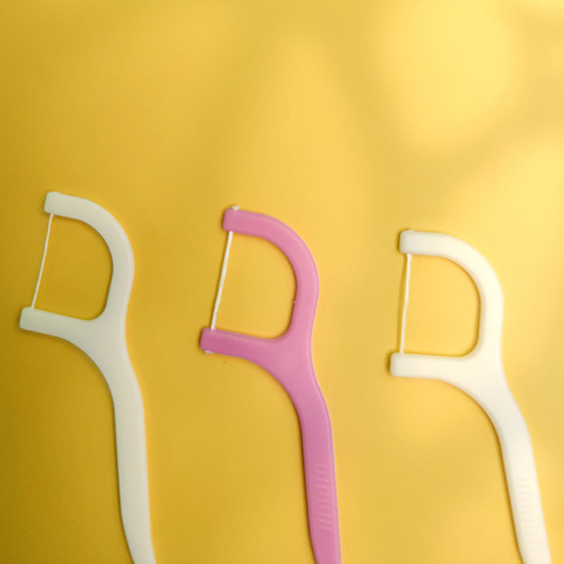 Handy dental floss picks designed for thorough plaque removal.