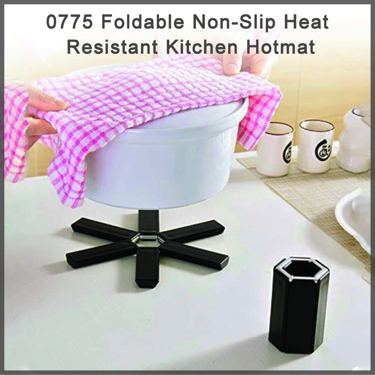 Foldable silicone hotmat protecting a kitchen counter from a hot pot.