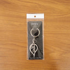 Metal Krishna symbol keychain, perfect for daily keys