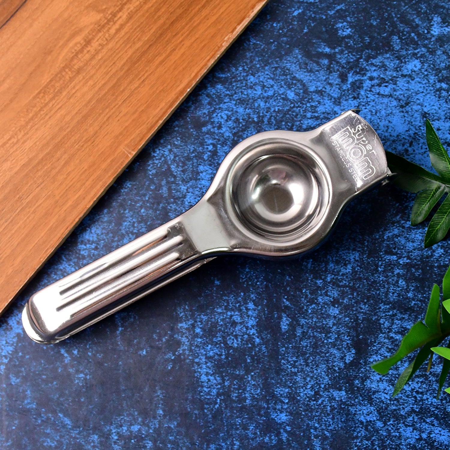 Manual steel lemon juicer showing ergonomic handles for comfortable grip