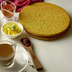 Close-up of Methi Khakhra showing fenugreek leaves and texture.