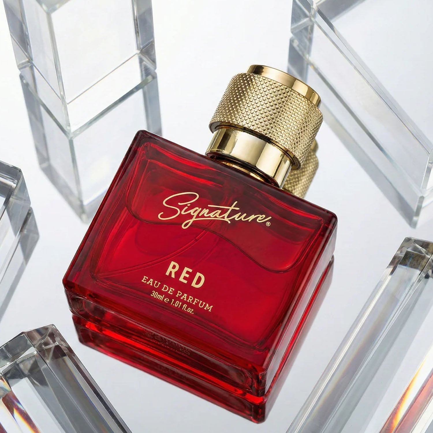 Signature premium red perfume spray bottle showing stylish design