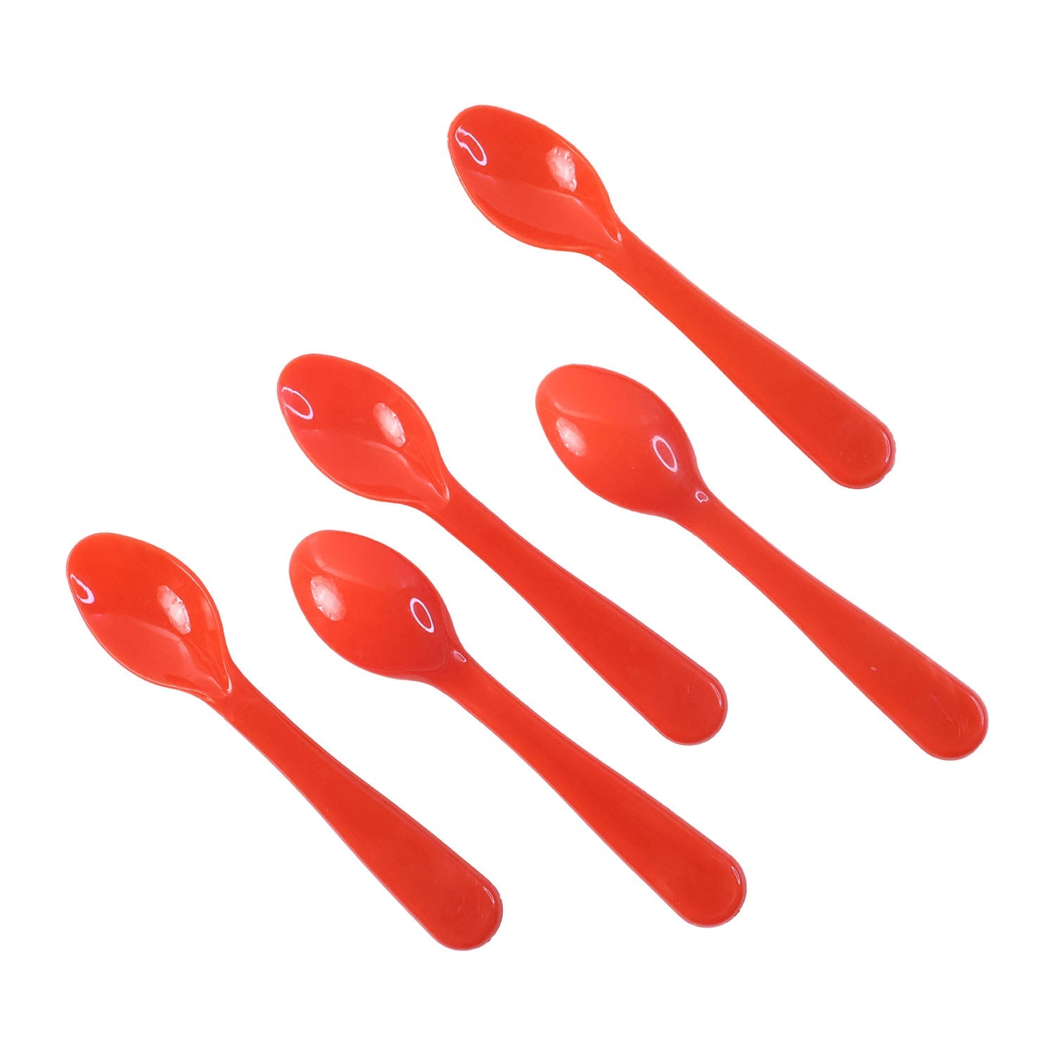 A hand using a white heat-resistant plastic spoon to serve a portion of food from a bowl.