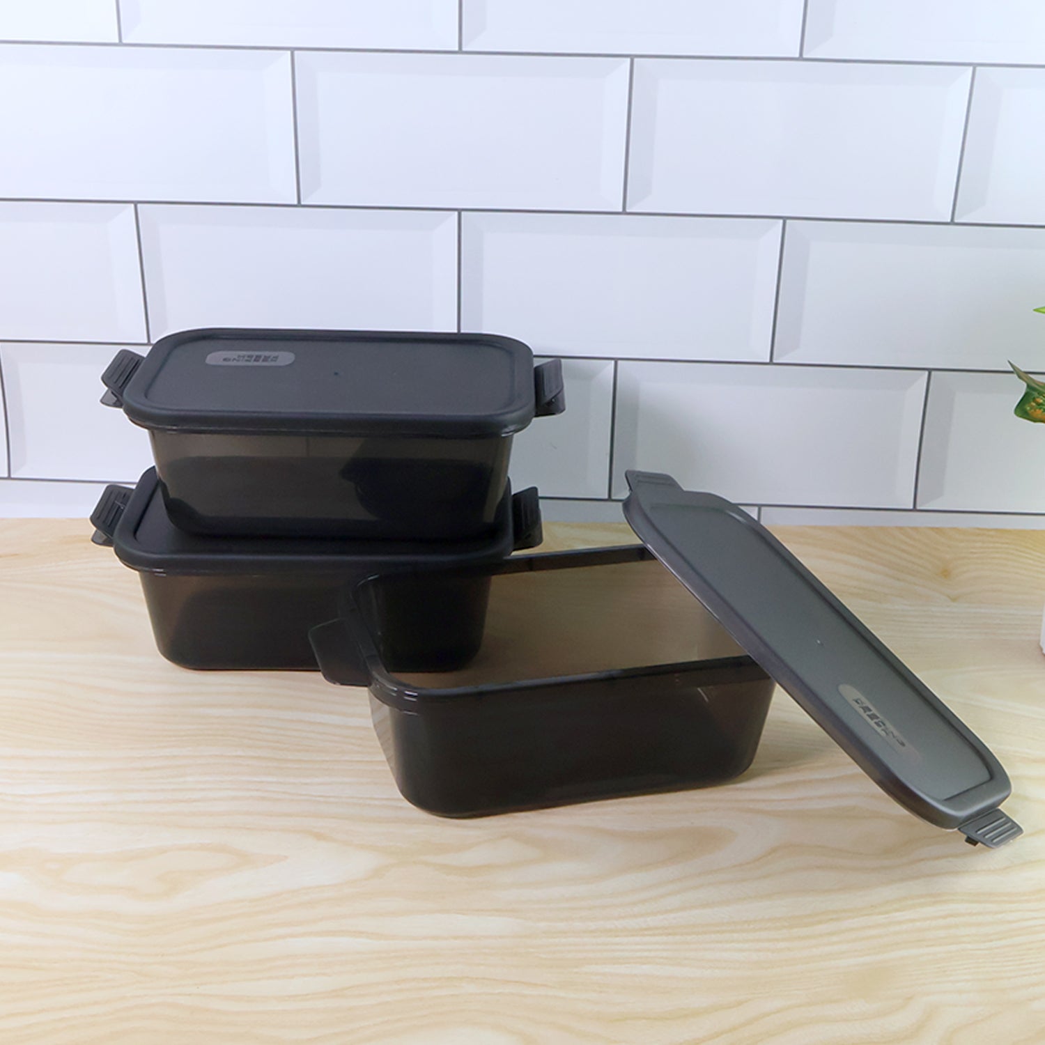 Close-up of a leakproof clip-lock lid on a rectangular food storage container.