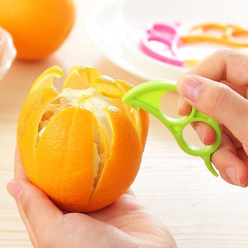 A Snail Orange Peeler with its unique ring design, ready to use for effortless citrus peeling.