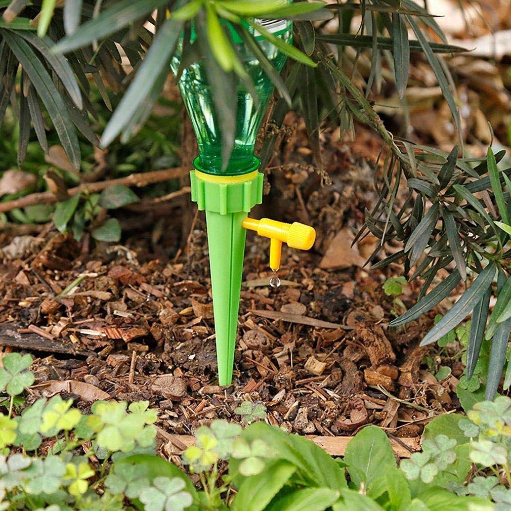 Drip irrigation kit with self-watering spikes installed in a plant pot.
