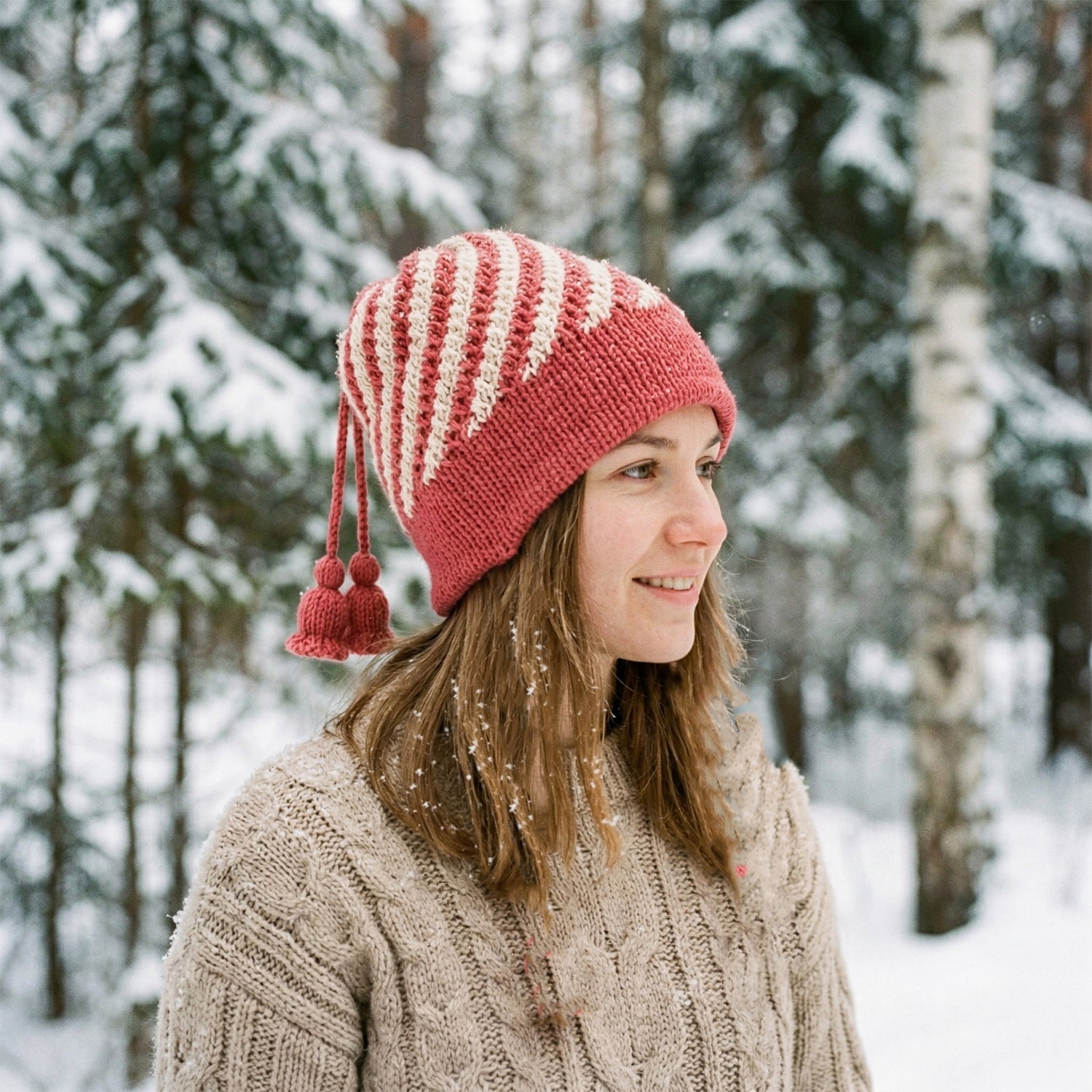 Stylish winter woolen knitted cap for men and women with pom-pom detail