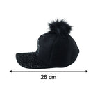 Side view of trendy winter baseball cap with pom pom