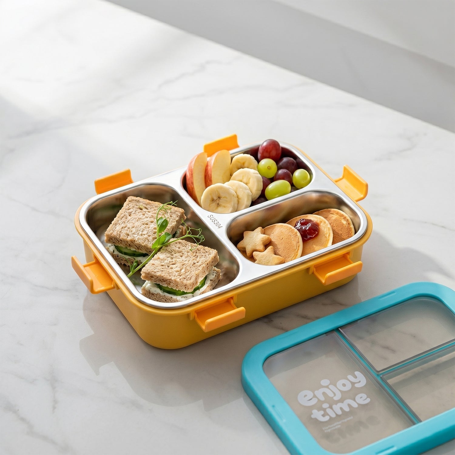 Lunch box with spoon and fork in side compartment