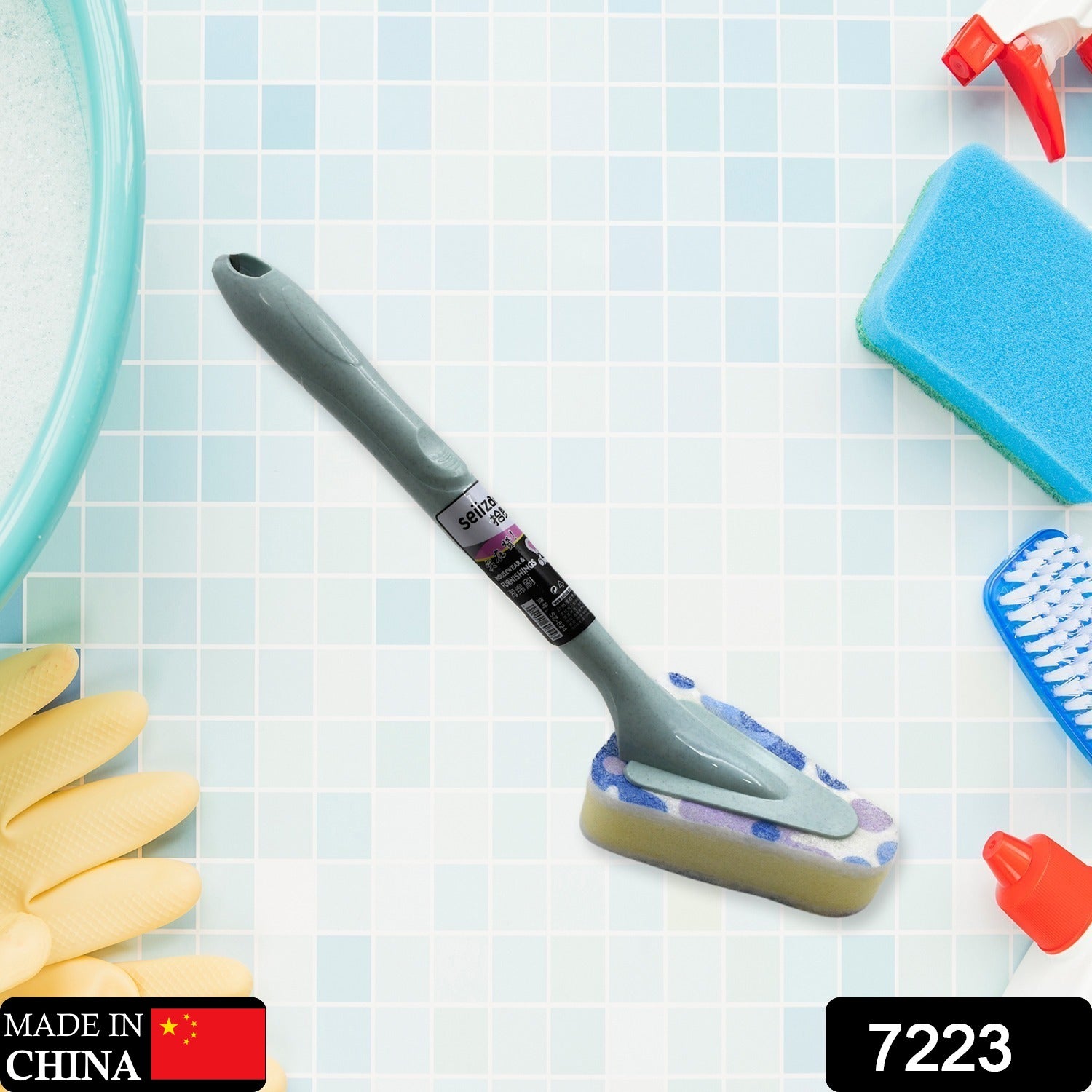 User cleaning a bathroom tub with the long handle triangular cleaning brush.