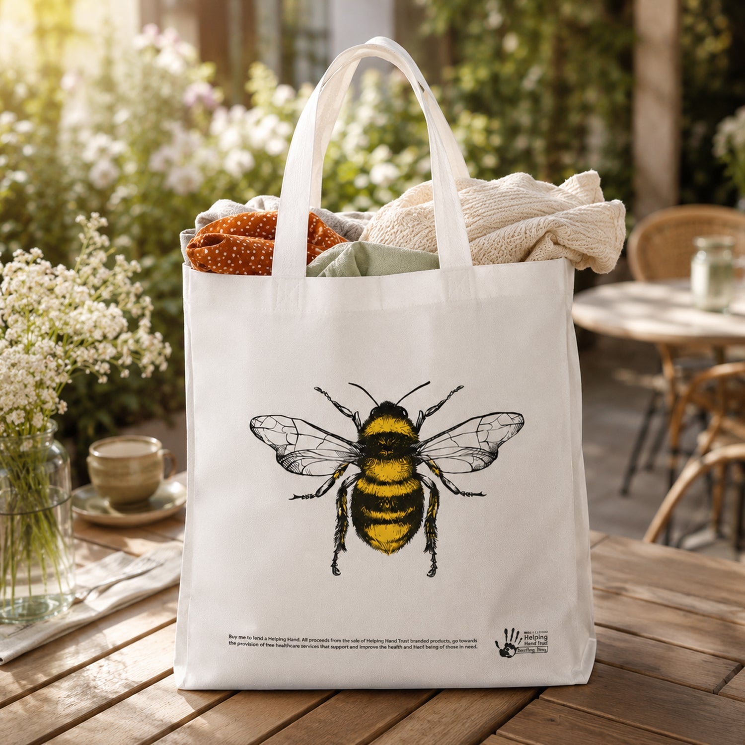 Outdoor garden scene with bee print tote bag
