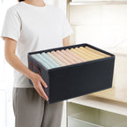 Sturdy foldable organizer box with side handles for carrying and moving with ease