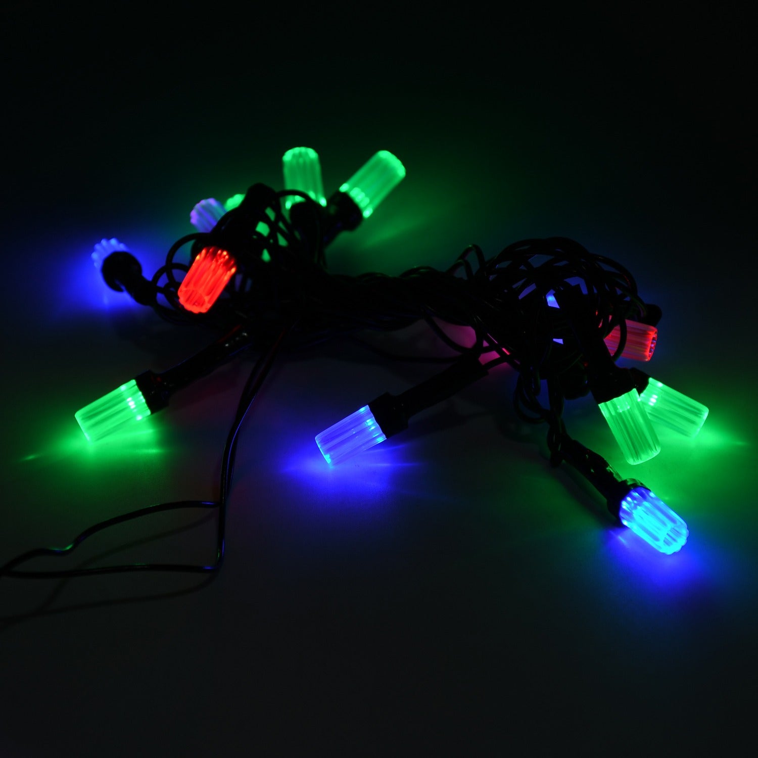 Vibrant multicolor Diwali LED string light illuminating a festive home scene.