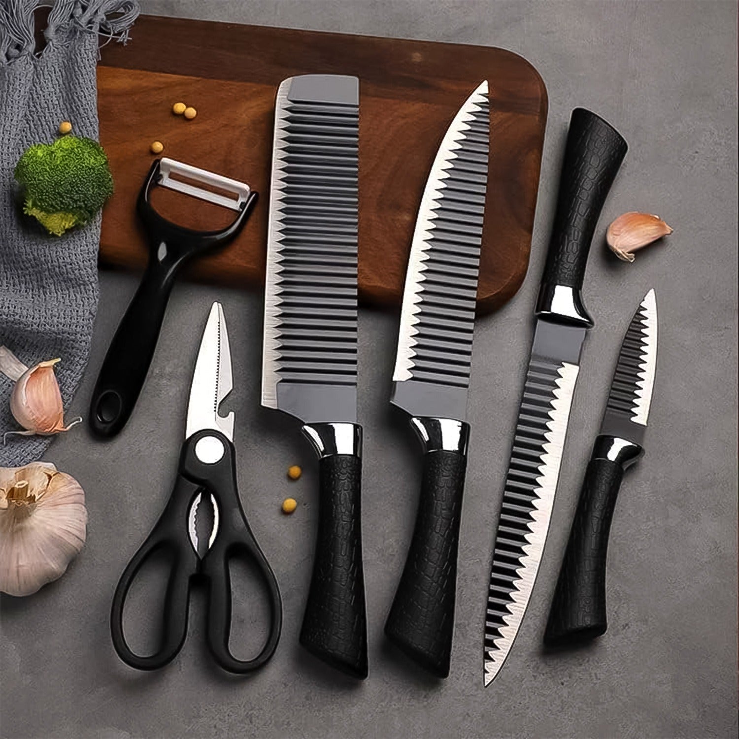 Full view of the 6-piece stainless steel kitchen knife set with peeler and scissors.
