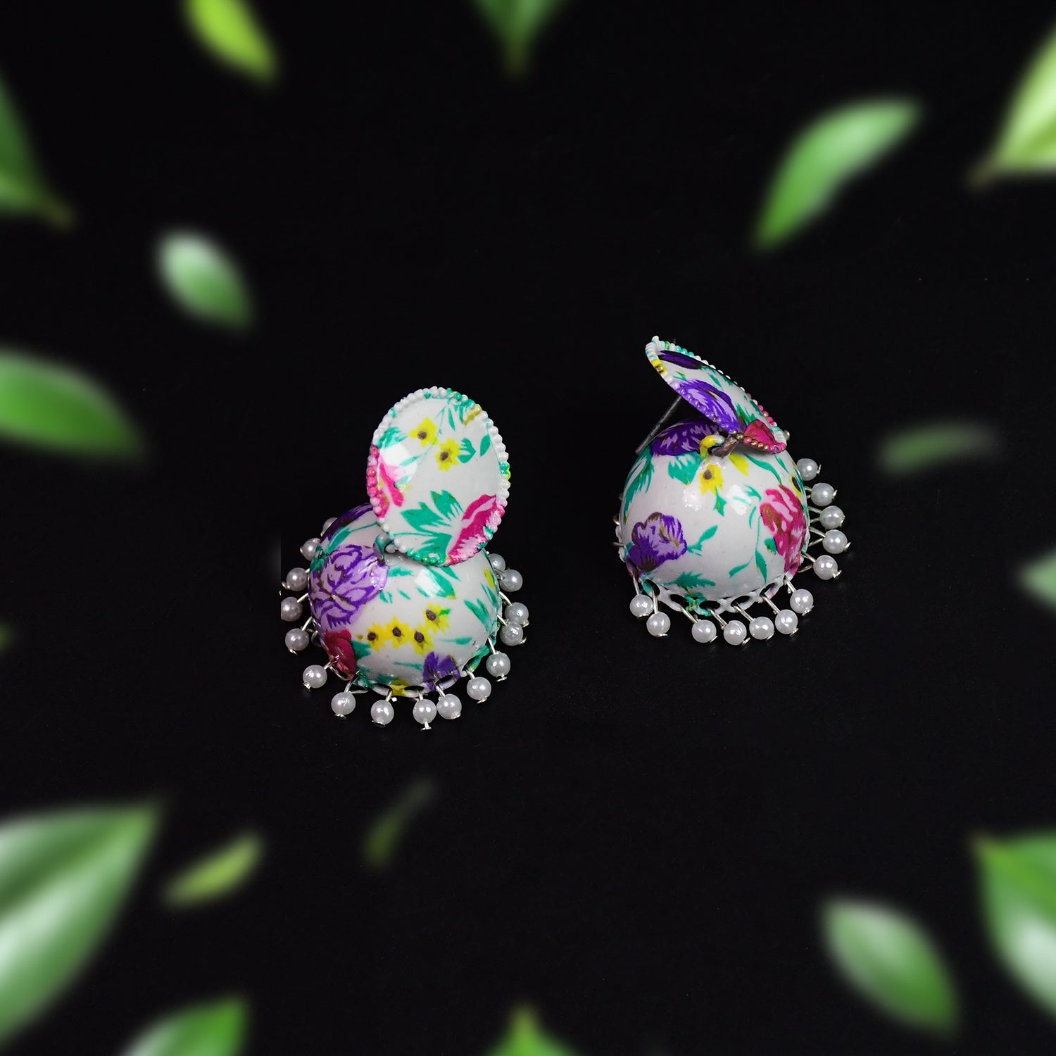 A pair of antique-finish Jhumka Earrings with subtle detailing, ideal for adding an ethnic touch to your look.