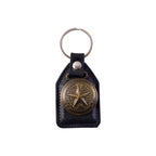 Metal star emblem keychain attached to a keyring for car keys
